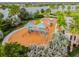 Aerial view of playground with vibrant play structures and lush green surroundings at 6642 Current Dr, Apollo Beach, FL 33572