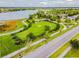 Aerial view of park featuring playgrounds, walking paths, and lake views at 6642 Current Dr, Apollo Beach, FL 33572