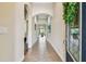 Welcoming foyer with tiled flooring, arched doorways, and a decorative wreath enhancing the entrance at 6642 Current Dr, Apollo Beach, FL 33572