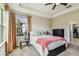 Main bedroom features a tray ceiling, a large window, and a serene ambiance at 6642 Current Dr, Apollo Beach, FL 33572