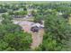 Aerial view of the property, displaying the surrounding landscape and privacy at 7606 Four Pines Rd, Plant City, FL 33565