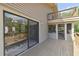 This home features a spacious back deck with sliding glass doors and a screened-in area, perfect for outdoor entertaining at 7606 Four Pines Rd, Plant City, FL 33565