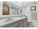 Bathroom featuring a double sink vanity with lots of counter space and a large mirror at 7606 Four Pines Rd, Plant City, FL 33565