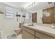 Bathroom with a large mirror, ample vanity space, and neutral fixtures for a functional, clean design at 7606 Four Pines Rd, Plant City, FL 33565