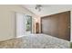 Bright bedroom with a vaulted ceiling, a closet, and balcony access at 7606 Four Pines Rd, Plant City, FL 33565