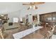 Open dining area showcasing vaulted ceilings, comfortable seating and access to the living room at 7606 Four Pines Rd, Plant City, FL 33565