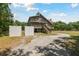 Inviting stilt home with double porches, accessed by exterior staircase at 7606 Four Pines Rd, Plant City, FL 33565