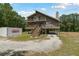 Inviting stilt home with double porches, accessed by exterior staircase at 7606 Four Pines Rd, Plant City, FL 33565