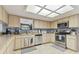 This kitchen has stainless steel appliances, a tile backsplash, and tile flooring, making it modern and easy to clean at 7606 Four Pines Rd, Plant City, FL 33565