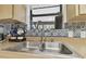Close-up view of the kitchen sink, with its clean design and adjacent countertop space, making it ideal for daily tasks at 7606 Four Pines Rd, Plant City, FL 33565