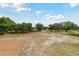 Expansive vacant land with scattered trees, a great potential for development at 7606 Four Pines Rd, Plant City, FL 33565