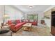 Cozy living room with plush seating, natural light, and neutral flooring, perfect for relaxing or entertaining at 7606 Four Pines Rd, Plant City, FL 33565