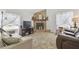 Cozy living room showcasing a stone fireplace, soft carpet, and comfortable seating arrangement at 7606 Four Pines Rd, Plant City, FL 33565