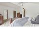 Large main bedroom featuring a vaulted ceiling, ceiling fan, and neutral carpeting at 7606 Four Pines Rd, Plant City, FL 33565