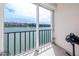 Water view from the balcony with a grill and black railing at 7645 Sun Island S Dr # 304, South Pasadena, FL 33707