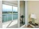 Balcony view showcasing the water with view of other buildings with grill and outdoor furniture at 7645 Sun Island S Dr # 304, South Pasadena, FL 33707