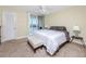 Well-lit main bedroom offers outdoor access and ample space at 7645 Sun Island S Dr # 304, South Pasadena, FL 33707