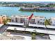 Waterfront condo building featuring assigned covered parking and well-manicured landscaping at 7645 Sun Island S Dr # 304, South Pasadena, FL 33707