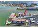 Waterfront condo building with an outdoor pool and assigned covered parking at 7645 Sun Island S Dr # 304, South Pasadena, FL 33707