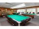Spacious game room featuring multiple pool tables and seating, perfect for entertainment and relaxation at 7645 Sun Island S Dr # 304, South Pasadena, FL 33707