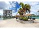 Community grilling area with tiki huts, picnic tables, and BBQ grills by the marina at 7645 Sun Island S Dr # 304, South Pasadena, FL 33707