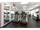 Well-equipped fitness center with treadmills, mirrors, and various exercise machines for a complete workout at 7645 Sun Island S Dr # 304, South Pasadena, FL 33707