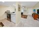 Well-equipped kitchen offering granite counters, stainless appliances, and seamless flow to living area at 7645 Sun Island S Dr # 304, South Pasadena, FL 33707