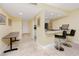 Open floor plan featuring breakfast bar area and modern kitchen with stainless steel appliances at 7645 Sun Island S Dr # 304, South Pasadena, FL 33707