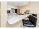 Bright kitchen featuring granite counters, stainless appliances, and breakfast bar with seating at 7645 Sun Island S Dr # 304, South Pasadena, FL 33707