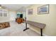 Cozy living room area with flat screen TV, neutral paint and access to front door at 7645 Sun Island S Dr # 304, South Pasadena, FL 33707