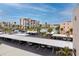 Community parking lot with covered parking and lush landscaping, plus a water view at 7645 Sun Island S Dr # 304, South Pasadena, FL 33707
