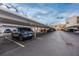 Community parking lot with covered parking, perfect for protecting your car at 7645 Sun Island S Dr # 304, South Pasadena, FL 33707