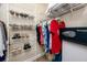 Well-organized walk-in closet with shelving, hanging rods, and a personal safe at 7645 Sun Island S Dr # 304, South Pasadena, FL 33707
