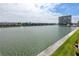 Scenic water view with condos, boats, green grass, and blue sky at 7645 Sun Island S Dr # 304, South Pasadena, FL 33707