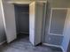 Bedroom closet with bi-fold doors and ample storage at 8440 Old Post Rd # 104, Port Richey, FL 34668