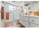 Bathroom with a glass-enclosed shower, tile floors, and a vanity with white cabinets at 9375 French Quarters Cir, Weeki Wachee, FL 34613