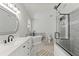 Bright bathroom featuring a soaking tub, glass-enclosed shower, and elegant fixtures at 9375 French Quarters Cir, Weeki Wachee, FL 34613