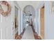 Welcoming entryway with wood floors and soft blue walls lead into the spacious living areas at 9375 French Quarters Cir, Weeki Wachee, FL 34613
