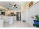 Spacious kitchen with island, stainless steel refrigerator, and ample cabinet space at 9375 French Quarters Cir, Weeki Wachee, FL 34613