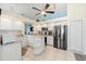 Open kitchen featuring stainless steel appliances, island, and vaulted ceiling at 9375 French Quarters Cir, Weeki Wachee, FL 34613
