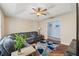 Comfortable living room features vaulted ceiling, ceiling fan and wood floors at 9375 French Quarters Cir, Weeki Wachee, FL 34613