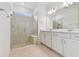 Bright bathroom with double vanity, large shower, and neutral finishes at 9408 Coastline Way, Parrish, FL 34219