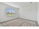 Carpeted bedroom with natural light, ready for relaxation and comfort at 9408 Coastline Way, Parrish, FL 34219