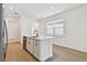 Kitchen island with sink, granite countertops, and sleek black faucet at 9408 Coastline Way, Parrish, FL 34219