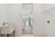 Bright laundry area leading to the kitchen with modern appliances at 9408 Coastline Way, Parrish, FL 34219