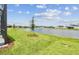 The backyard has a serene view of the lake at 9530 Coastline Way, Parrish, FL 34219