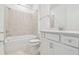 This bathroom is equipped with a shower and bath, as well as updated vanity at 9530 Coastline Way, Parrish, FL 34219