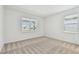 Comfortable bedroom with neutral walls, plush carpeting, and large windows offering plenty of natural light at 9530 Coastline Way, Parrish, FL 34219