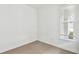 This bedroom features wood floors and a window letting in lots of natural light at 9530 Coastline Way, Parrish, FL 34219