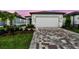 Charming single Gathering home with a large garage and paver driveway at 9530 Coastline Way, Parrish, FL 34219